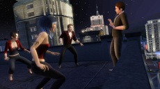 Three vampires force a regular Sim into a corner